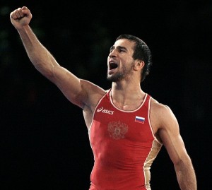 Russia's Albiev celebrates after defeating Uzbekistan's Aripov at the World Wrestling Championships 2009 in Herning